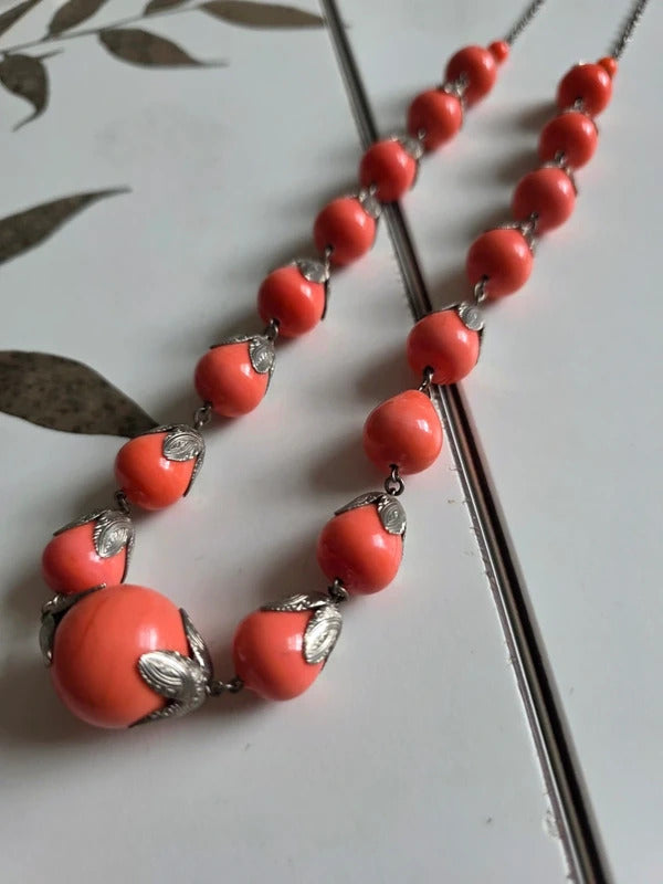 Vintage 1930s 1940s long Coral-Coloured Glass Bead Necklace with Silver Tone Leaf Caps