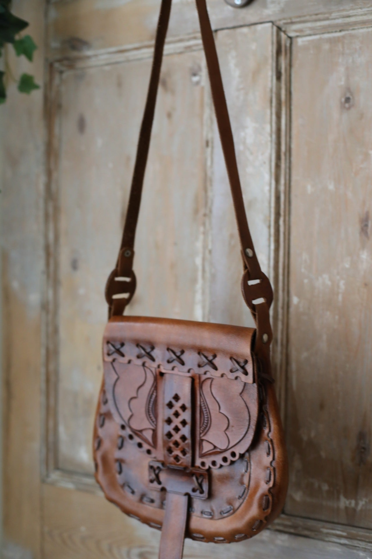 Vintage early 1970s brown tooled leather shoulder bag