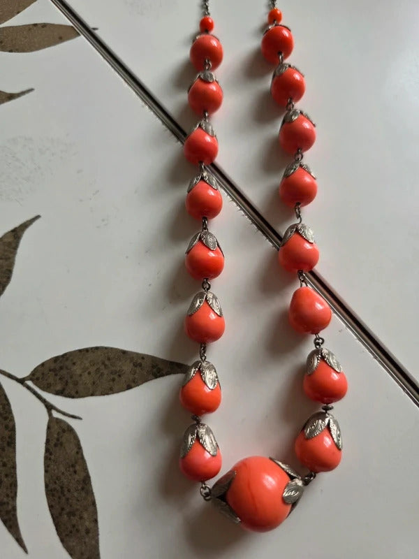 Vintage 1930s 1940s long Coral-Coloured Glass Bead Necklace with Silver Tone Leaf Caps