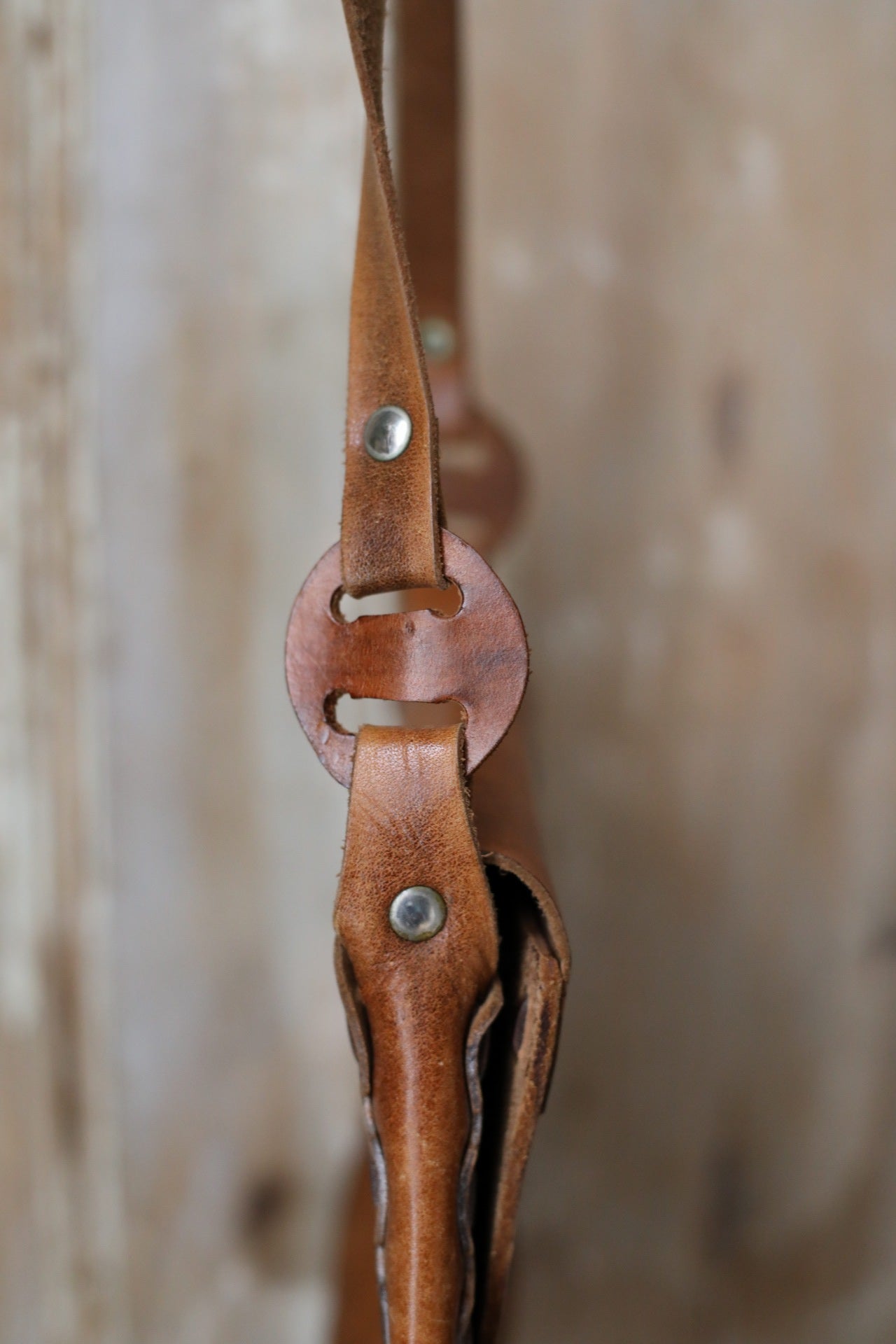 Vintage early 1970s brown tooled leather shoulder bag