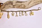Load image into Gallery viewer, Vintage Wales charm bracelet - gold tone costume jewellery
