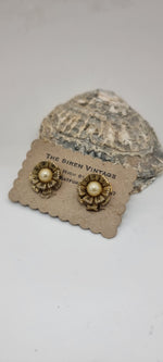 Load image into Gallery viewer, Vintage 1950s Damascene sweet little flower clip on earrings
