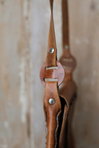 Vintage early 1970s brown tooled leather shoulder bag