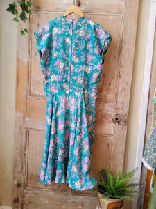 Vintage 1970s does 1950s floral fit and flare dress.