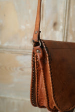 Load image into Gallery viewer, Vintage 1970s Tan Brown Tooled REAL Leather Crossbody Saddle Bag Boho Festival
